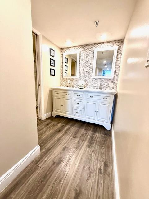 bathroom featuring vanity and wood-type flooring