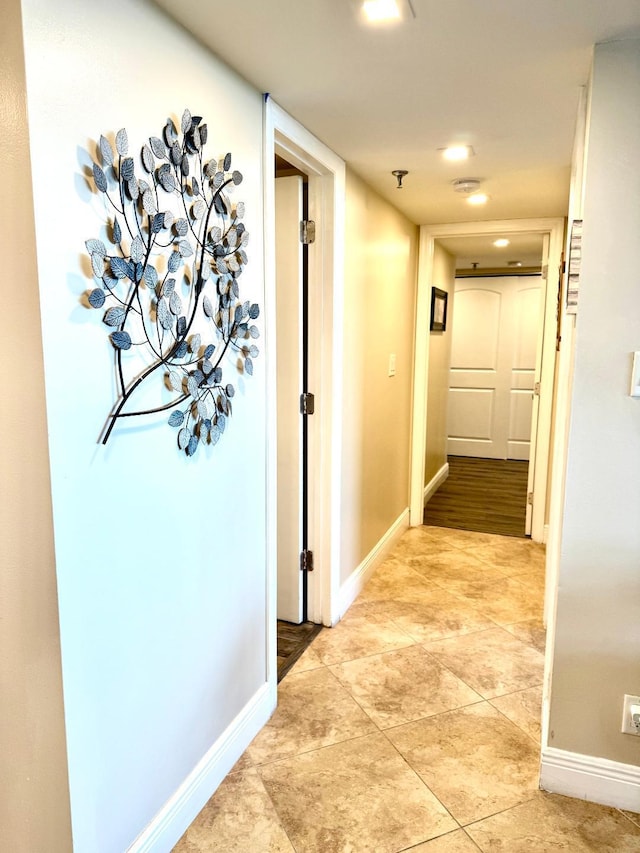 hallway with light tile patterned floors