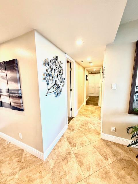 corridor with tile patterned floors