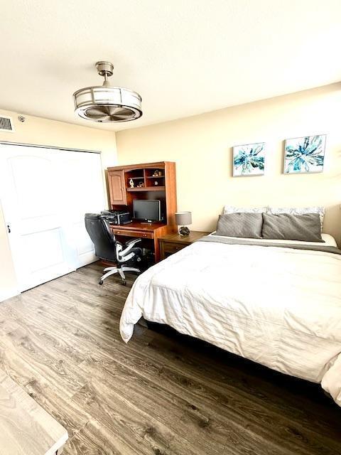 bedroom featuring wood-type flooring