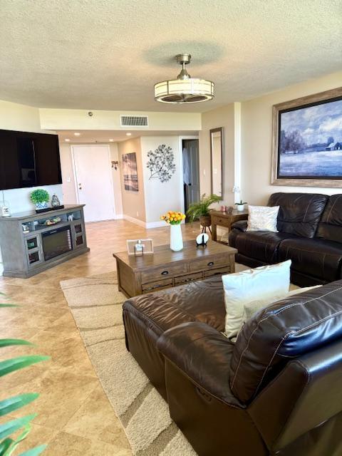 living room featuring a textured ceiling