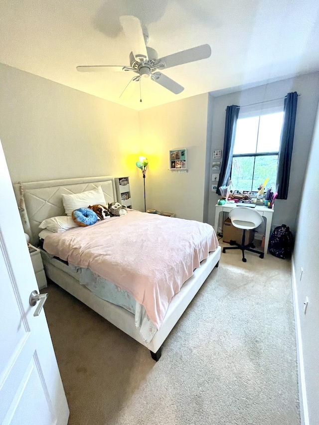 carpeted bedroom with a ceiling fan