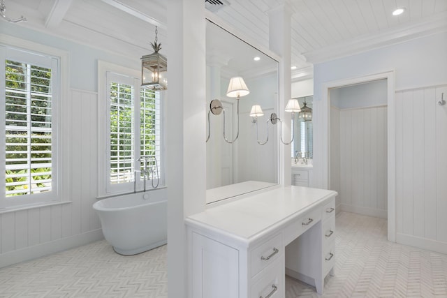 bathroom featuring a bathtub, wood walls, vanity, and ornamental molding