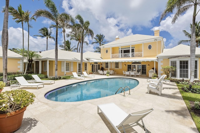 view of swimming pool with a patio area