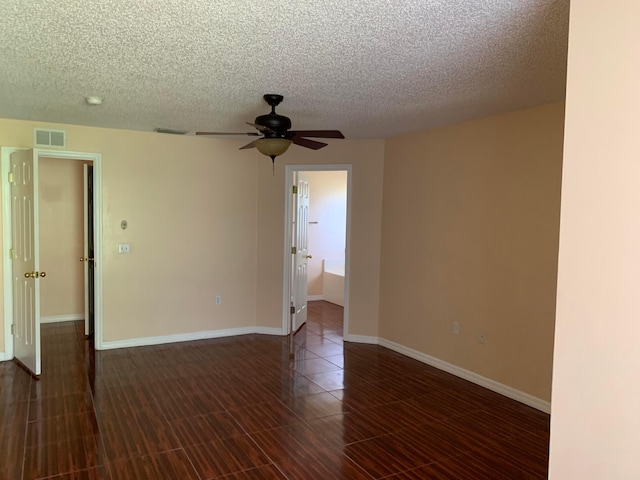 tiled empty room with a textured ceiling and ceiling fan