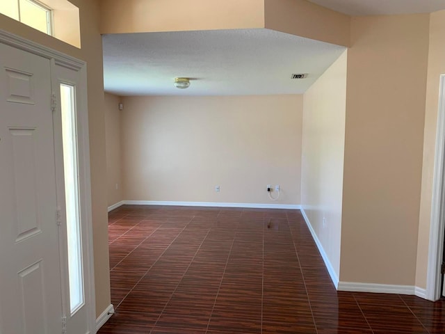 tiled foyer entrance with a wealth of natural light