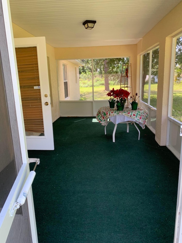 unfurnished sunroom with a wealth of natural light