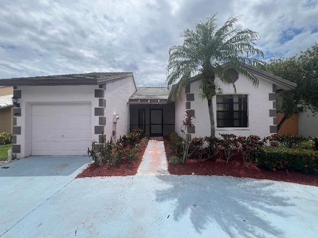 view of front of property with a garage