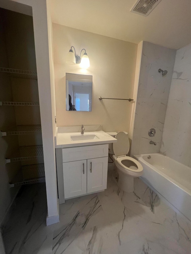 full bathroom with toilet, tiled shower / bath, and vanity