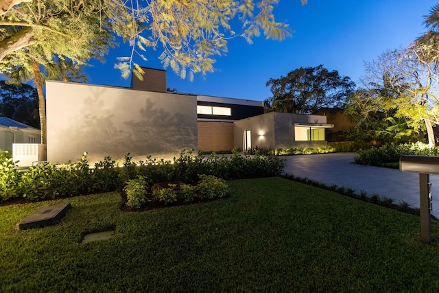 contemporary house with a front lawn