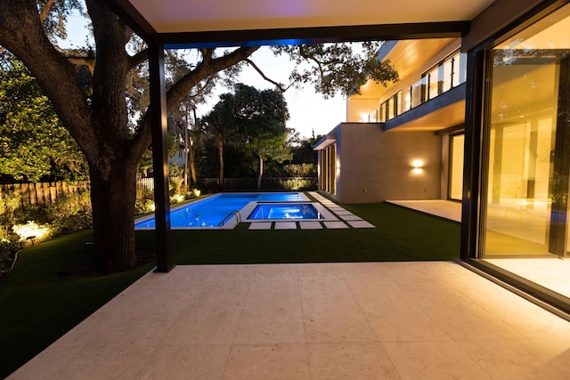 view of swimming pool featuring a patio