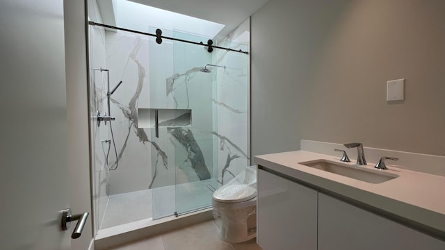 bathroom featuring toilet, vanity, a shower with shower door, and tile flooring