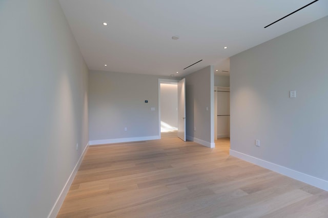 empty room with light hardwood / wood-style floors