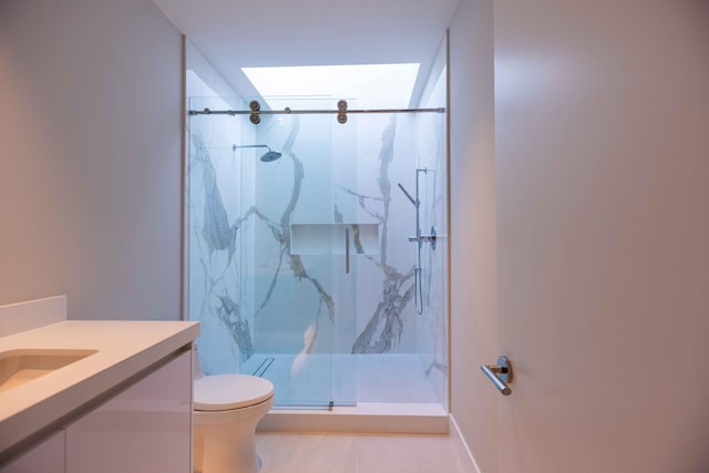 bathroom featuring walk in shower, toilet, tile floors, and vanity