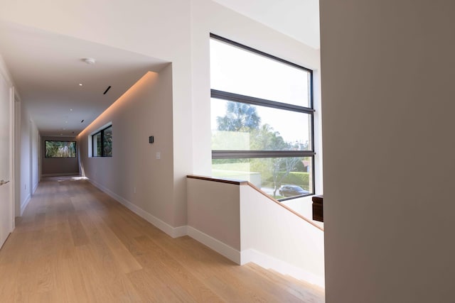 hall with light hardwood / wood-style floors