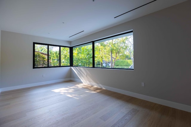 unfurnished room featuring light wood-type flooring