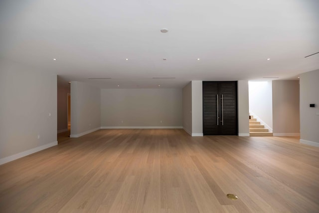 unfurnished living room with light hardwood / wood-style floors