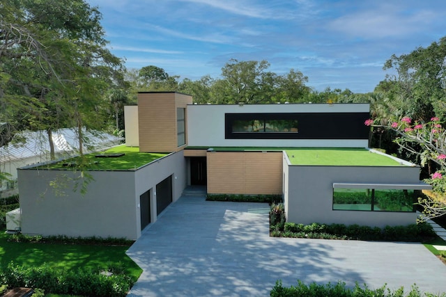 modern home with a front lawn