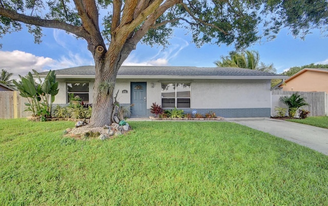 ranch-style home with a front lawn