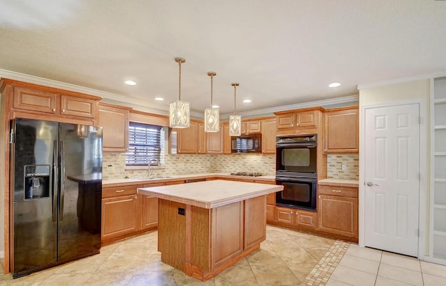 kitchen featuring black appliances, sink, ornamental molding, decorative light fixtures, and a kitchen island