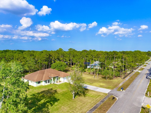 drone / aerial view with a view of trees