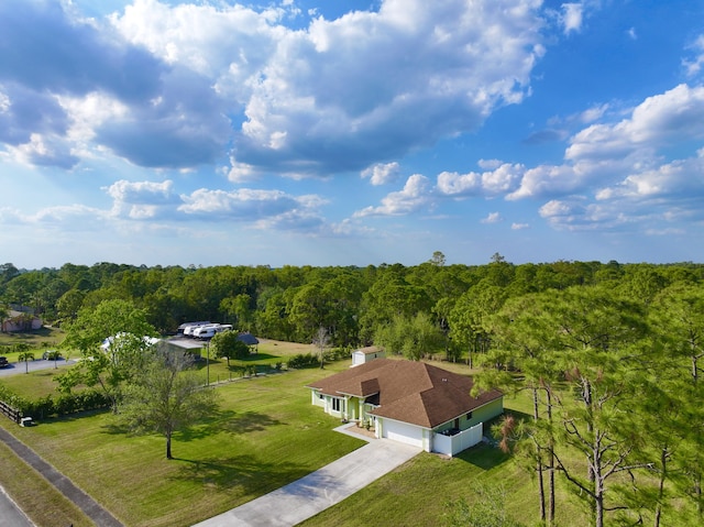 aerial view featuring a view of trees