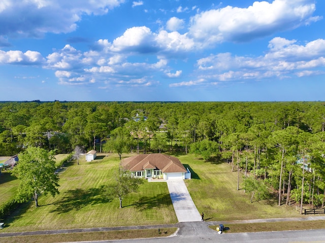 bird's eye view featuring a view of trees