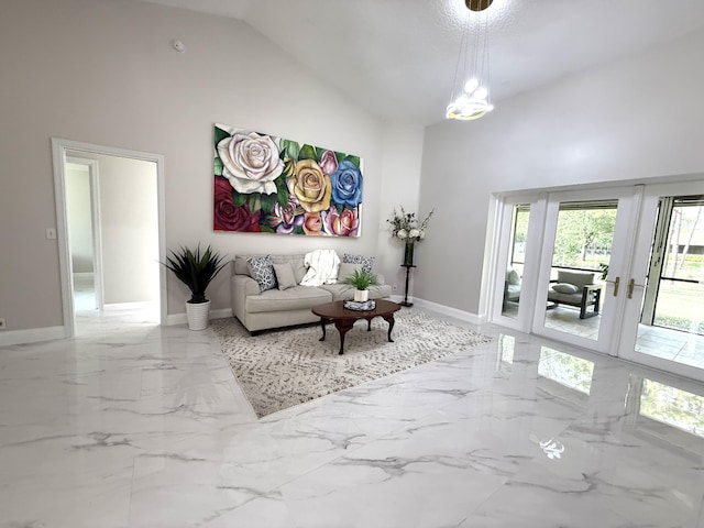 living area with french doors, baseboards, high vaulted ceiling, and marble finish floor