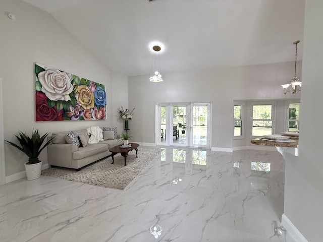 living room with plenty of natural light, marble finish floor, high vaulted ceiling, and baseboards