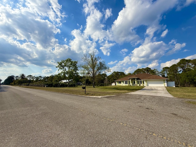 view of road with aphalt driveway