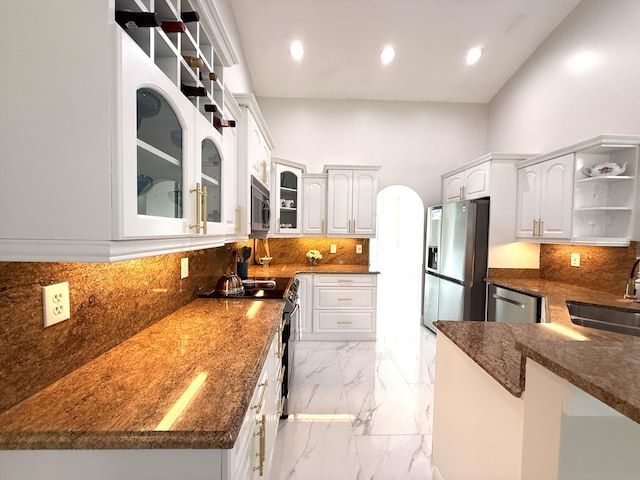 kitchen featuring open shelves, a sink, glass insert cabinets, appliances with stainless steel finishes, and marble finish floor