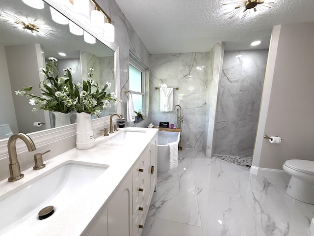 bathroom with a textured ceiling, marble finish floor, a marble finish shower, and a sink