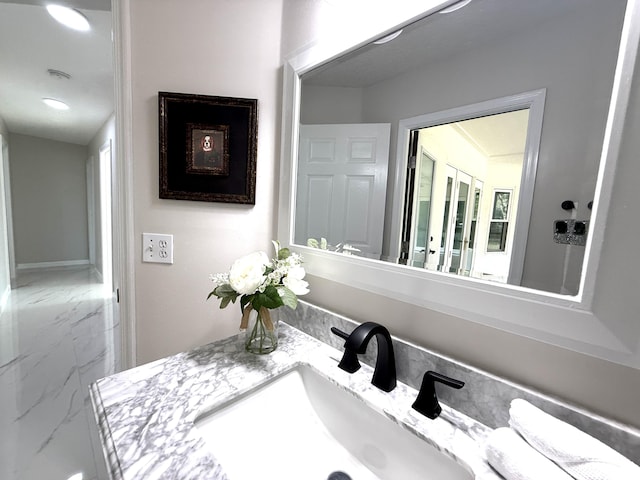 bathroom featuring vanity and marble finish floor