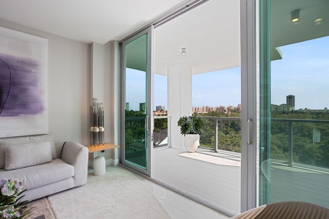 living room with floor to ceiling windows and a wealth of natural light