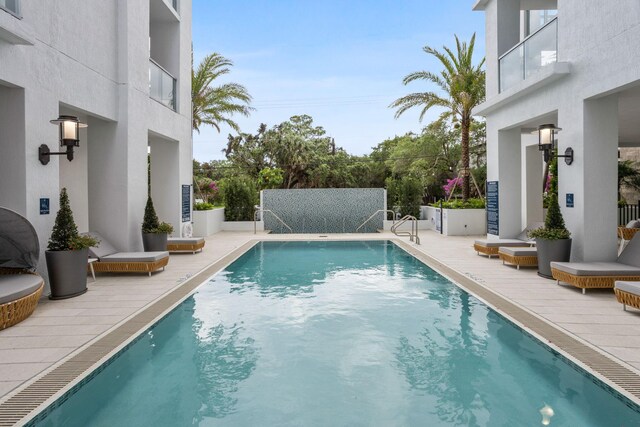 view of pool featuring a patio area