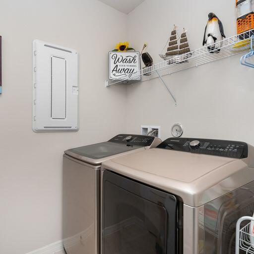 clothes washing area with hookup for a washing machine and washing machine and clothes dryer