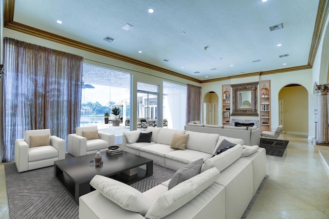 living room with a textured ceiling and ornamental molding