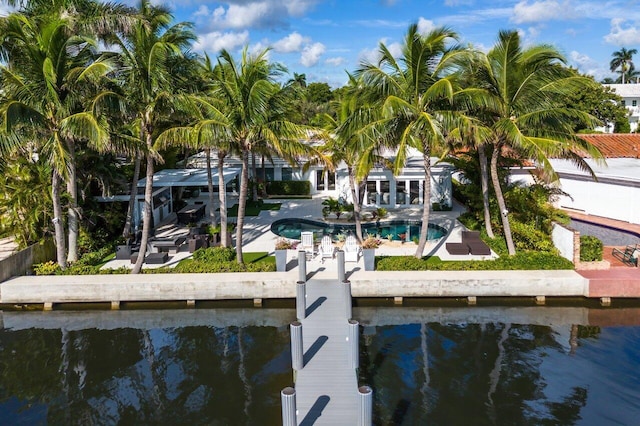 dock area with a patio area and a water view