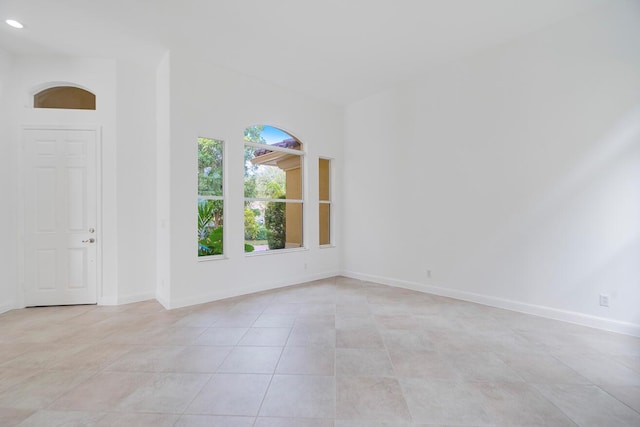 empty room with light tile floors