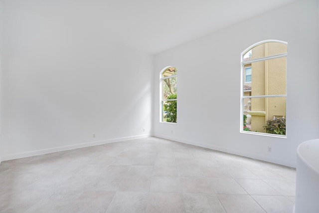 spare room featuring light tile floors