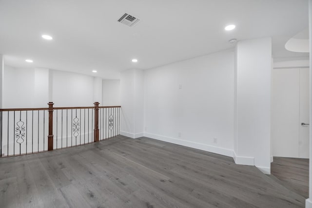 empty room featuring dark hardwood / wood-style flooring