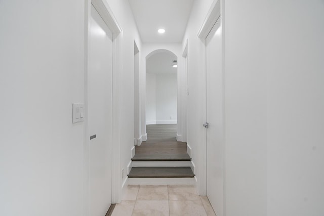 hall featuring light tile floors