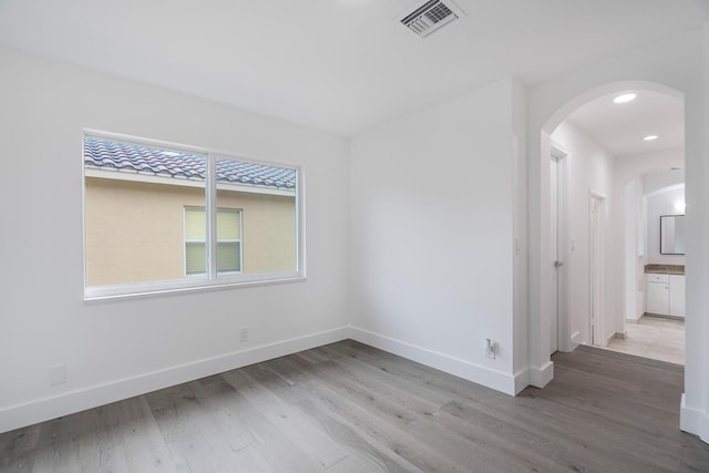 spare room featuring light wood-type flooring