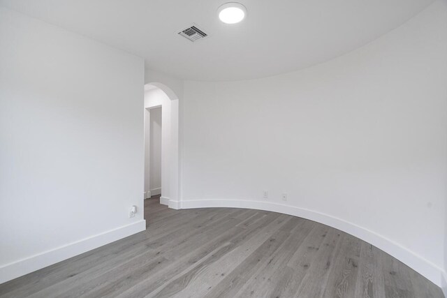 spare room with light hardwood / wood-style floors