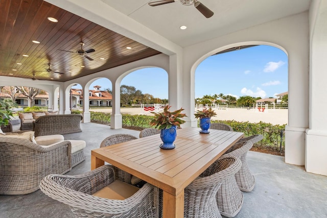 view of terrace featuring outdoor lounge area and ceiling fan