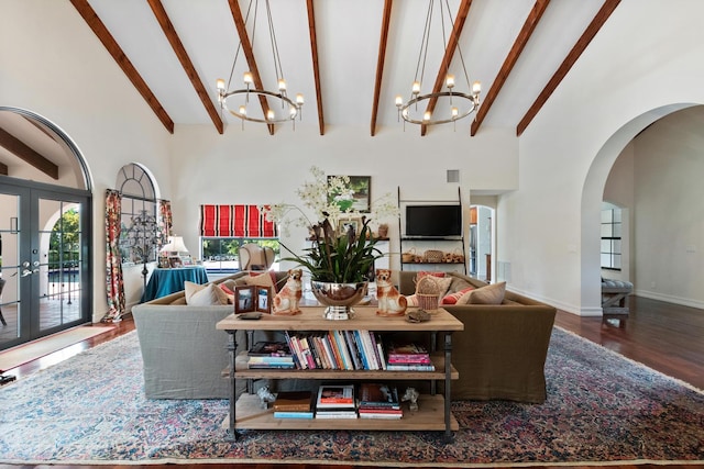 living room featuring french doors, hardwood / wood-style floors, a chandelier, and a wealth of natural light