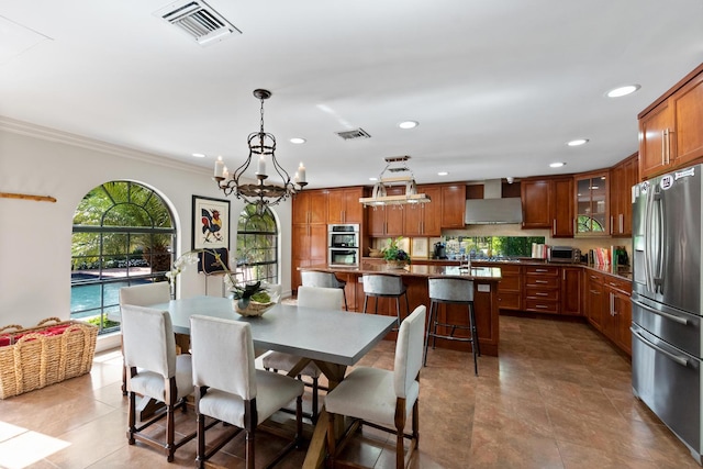 tiled dining room featuring ornamental molding and a notable chandelier