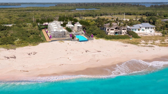 aerial view featuring a water view and a beach view