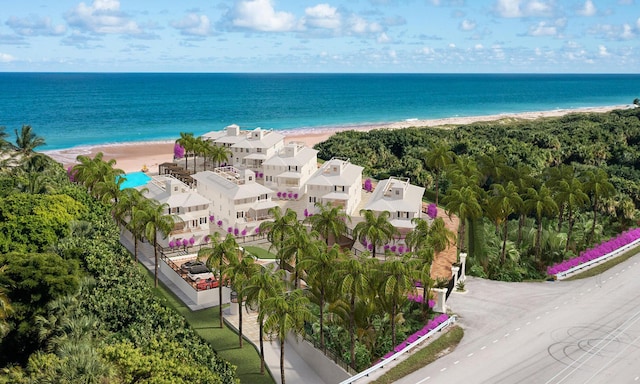 bird's eye view featuring a water view and a view of the beach