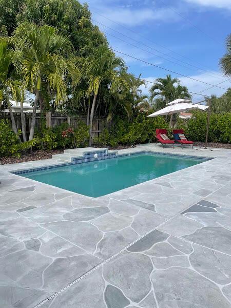 view of swimming pool featuring a patio